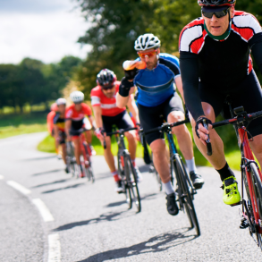 group of road cyclist riding on road