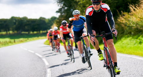 group of road cyclist riding on road