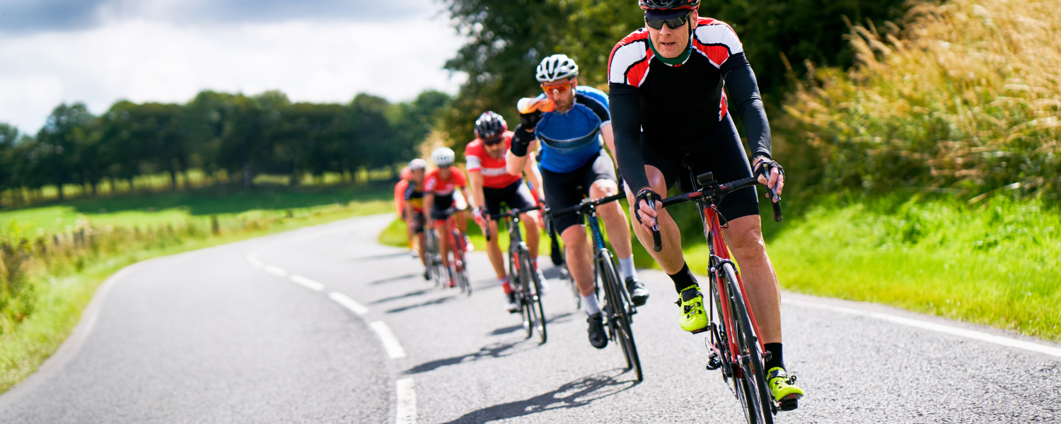 group of road cyclist riding on road