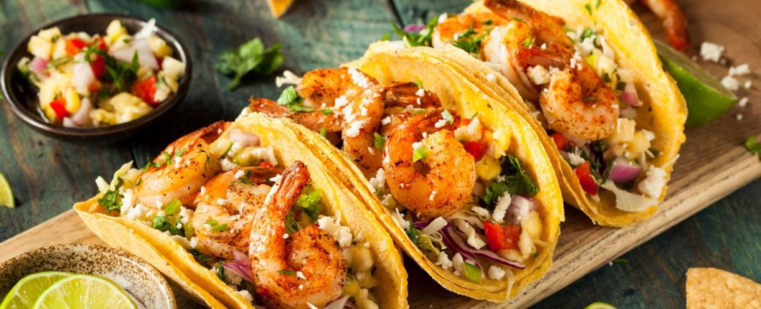 three fish tacos on a platter