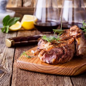 steak and wine on a tray