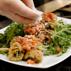 Chef garnishing dish