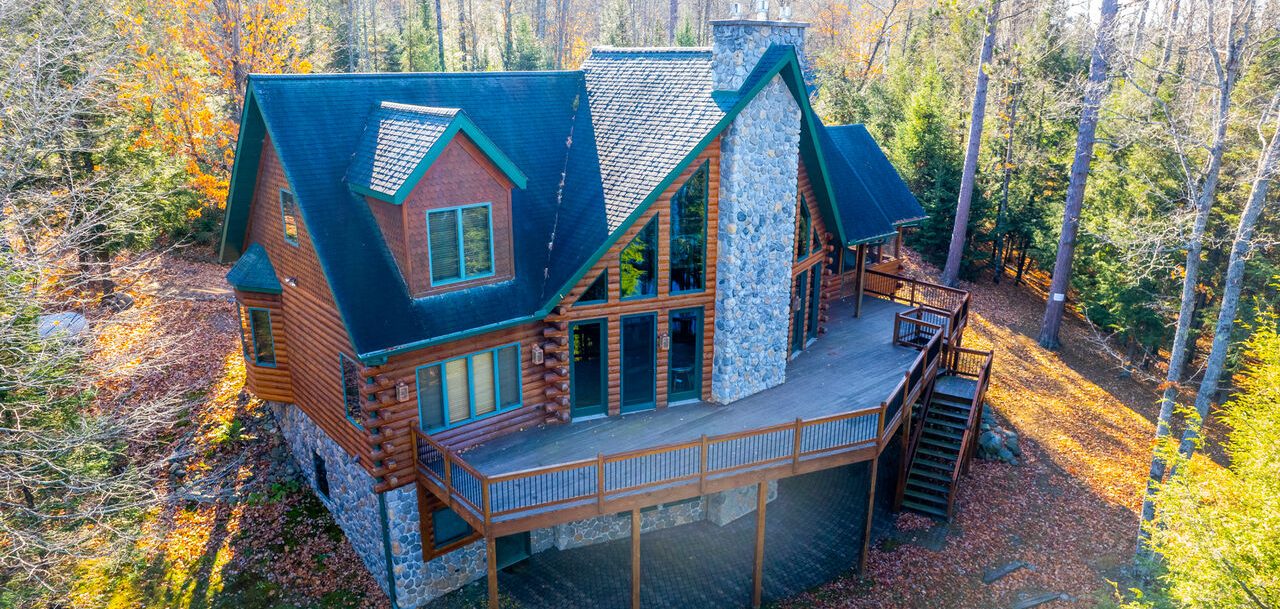   Single family home in the middle of the woods on a sunny day