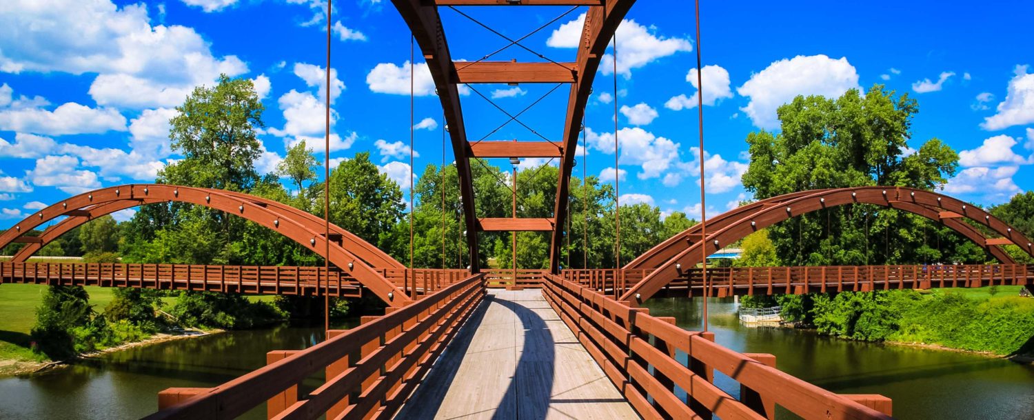 A pedestrian bridge in Michigan that is perfect for Sustainable Travel to Michigan.
