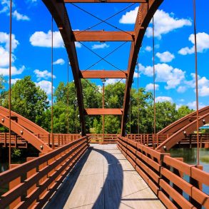A pedestrian bridge in Michigan that is perfect for Sustainable Travel to Michigan.