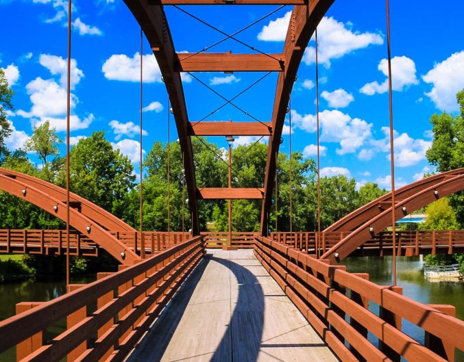 A pedestrian bridge in Michigan that is perfect for Sustainable Travel to Michigan.