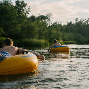 group of people tubing on river
