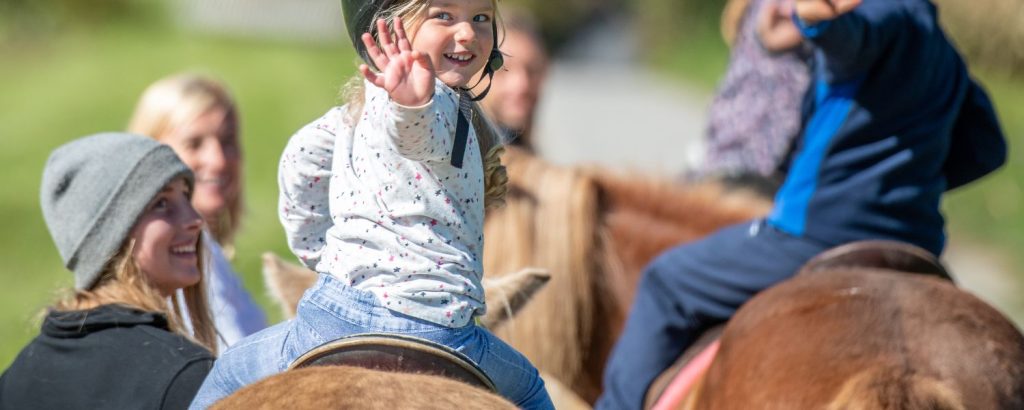 young girl riding a horse