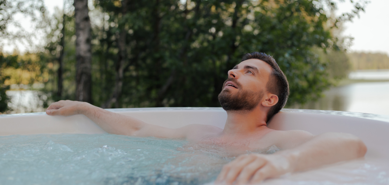   man relaxing in hot tub