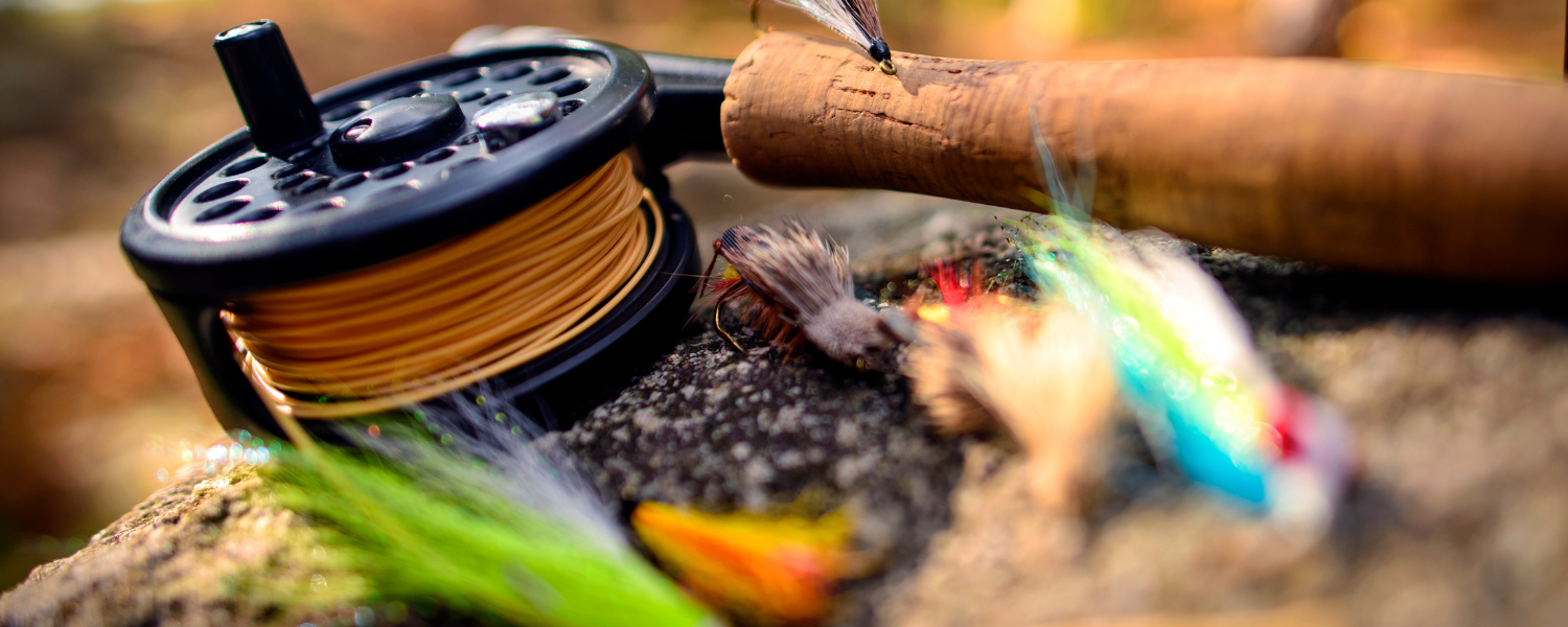 fly fishing rod, reel, and flies