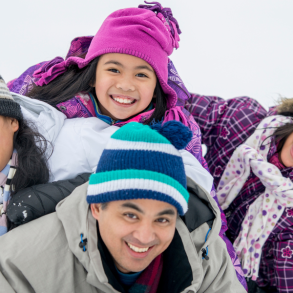 family of four in snow