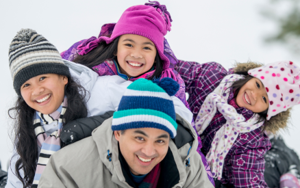 family of four in snow