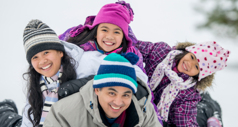 family of four in snow