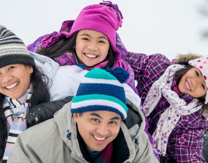 family of four in snow