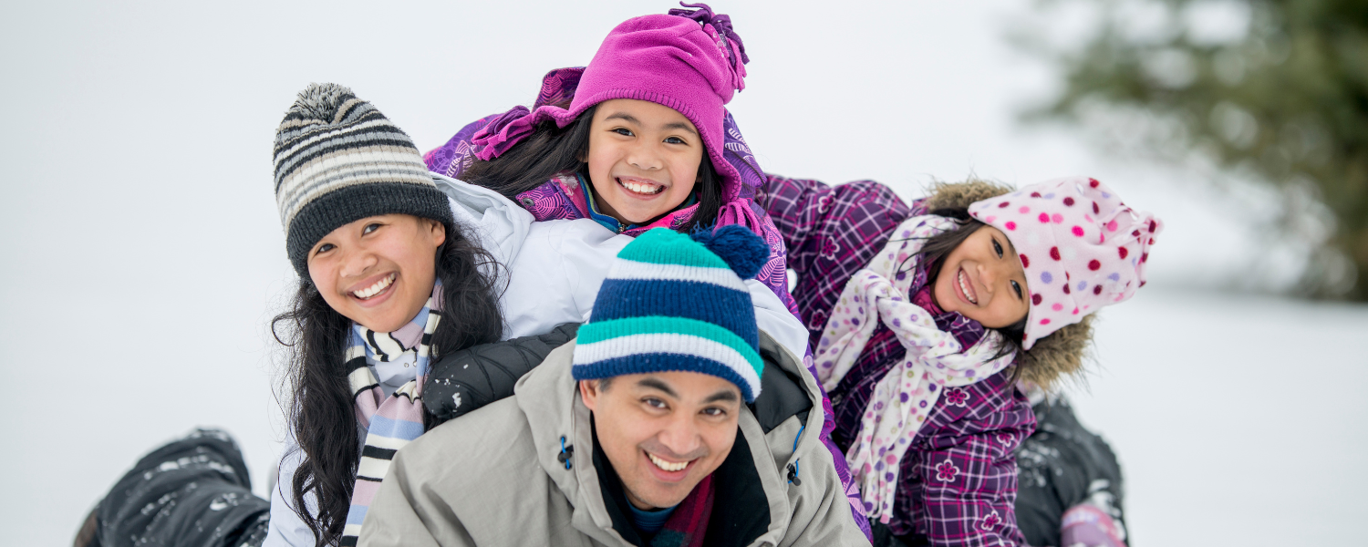 family of four in snow
