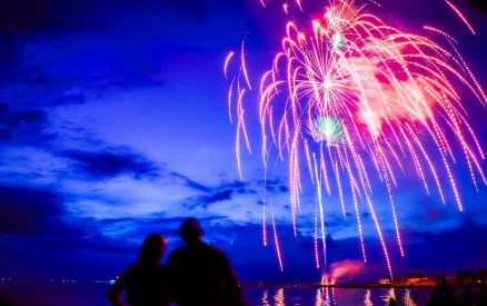 Fireworks over Lake Michigan at dusk.