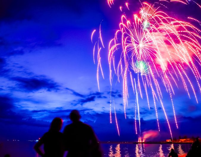 Fireworks over Lake Michigan at dusk.