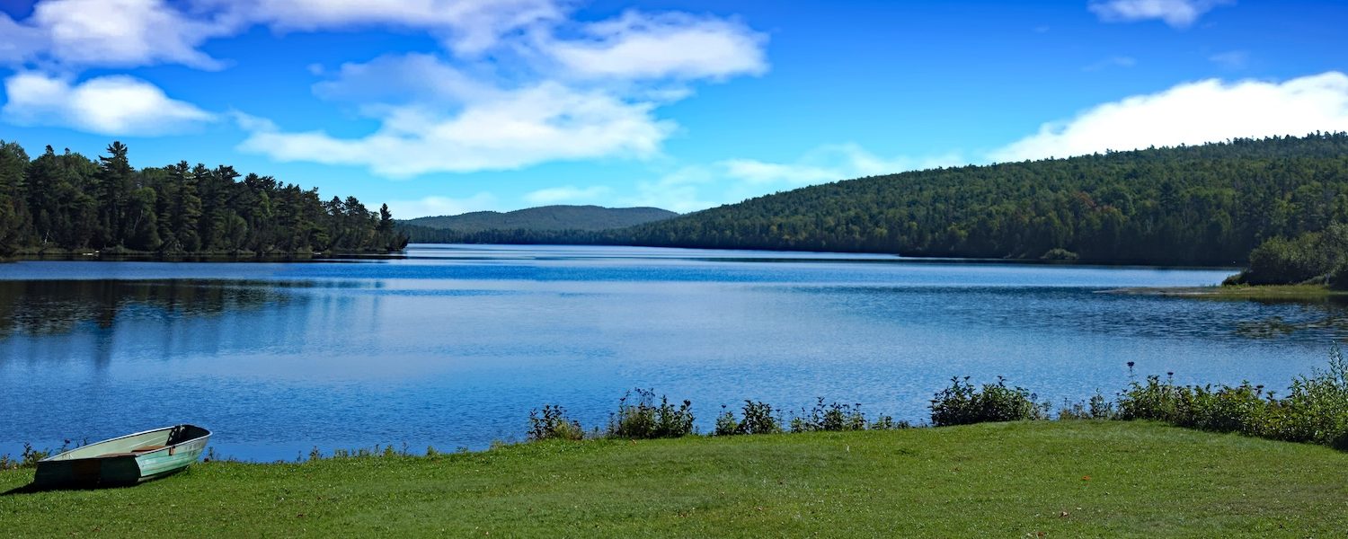 A summer camp setting on an alpine lake in Northern Michigan.