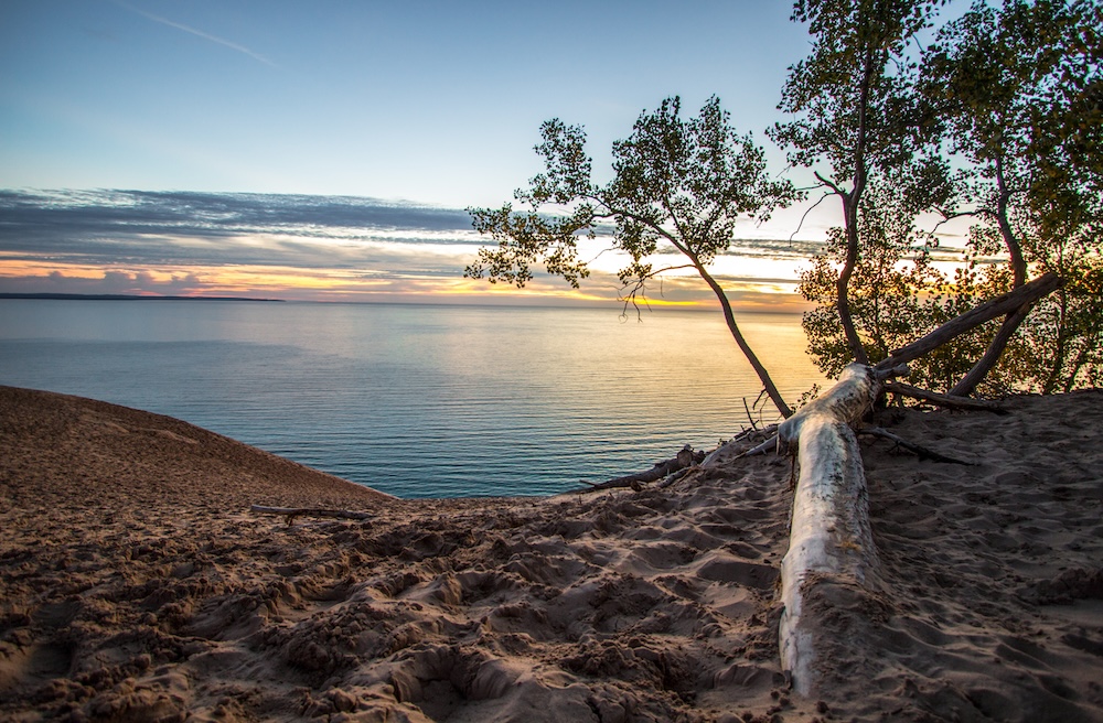 Sleeping Bear Dunes National Lakeshore overlooking a sunset on Lake Michigan.